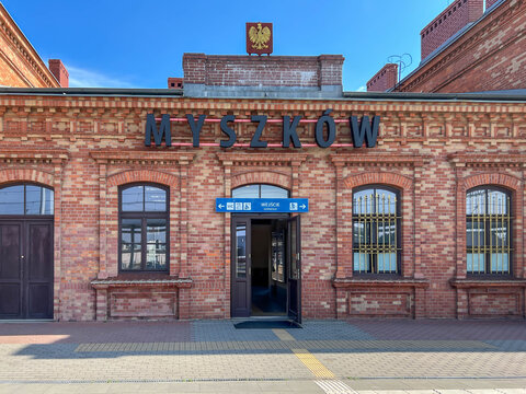 Myszkow, Poland, July 26, 2025: The railway station building in Myszkow. The red brick building is unplastered