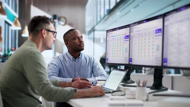Procurement Manager And Analyst Review Vendor Proposals On Laptop