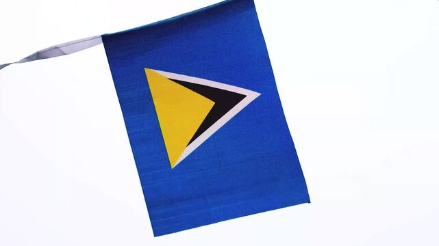 Saint Lucia national flag waving in the wind, representing Saint Lucia Independence Day, Caribbean identity and national pride. Blue flag with distinctive black, white and gold triangles, suitable for