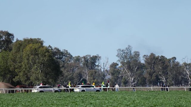 Jockeys and Horses Preparing for Race at Country Track