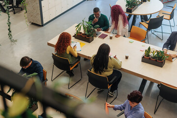 Diverse team collaborating in modern coworking office space