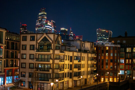 Nighttime London Cityscape with Historic Buildings and Modern Skyscrapers