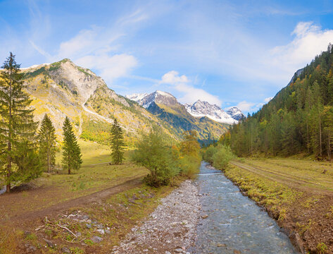 wonderful autumnal Oytal valley, Stuibenbach creek, view to allgau alps