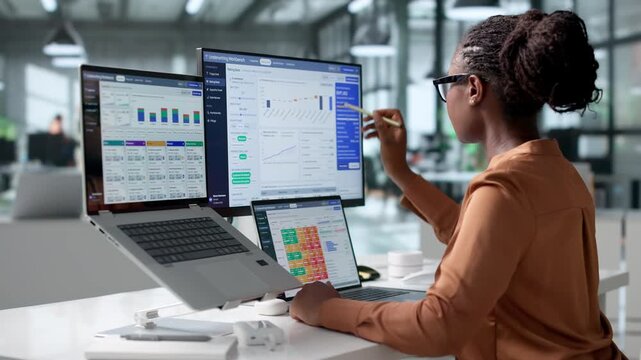 Insurance Underwriter Reviews Policy Data On Laptop Assessing Risk