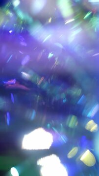 Christmas glowing background. Colorful motion abstract pink purple blue light