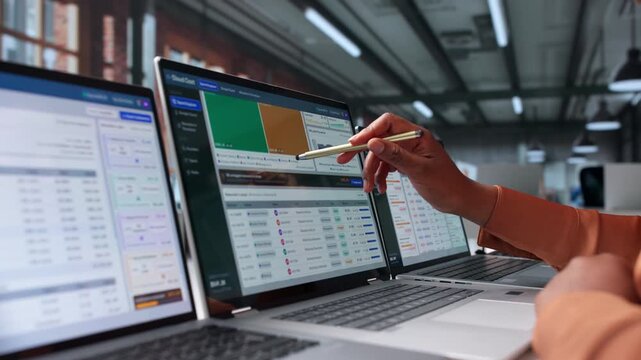 Financial Analyst Studies Cloud Cost Reports On Laptop