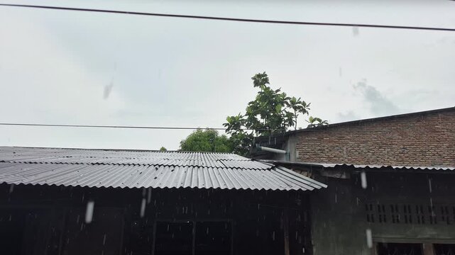 The sight of rain on a corrugated iron roof