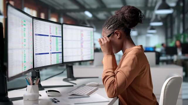 Medical Coder Reviews Billing Codes On Computer