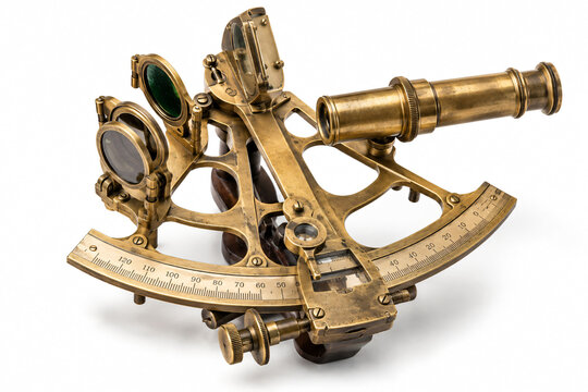 Antique brass marine sextant with optical lenses and graduated scale, isolated on a white background