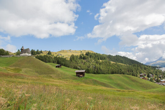 Landscape / mountain range with chapel at Swiss Alps near Arosa, Switzerland