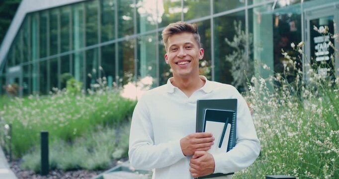 Portrait of student man in park for university, learning and education. Youth, scholarship and gen z on school campus for knowledge, future or student