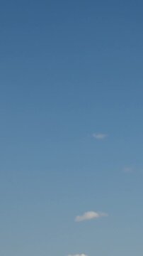 clear sky with single clouds during the day