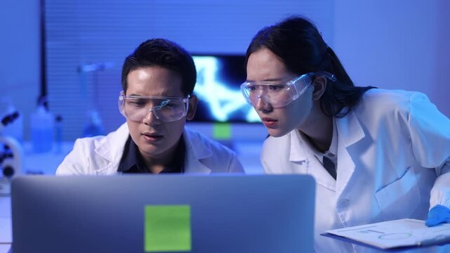 A young scientist looks stressed in the laboratory.