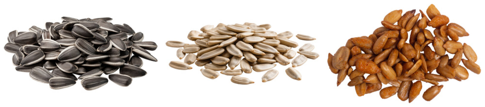 Three piles of sunflower seeds: raw striped, shelled white, and roasted brown, isolated on a white background.