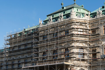 Ornate building facade covered with scaffolding © iBennn