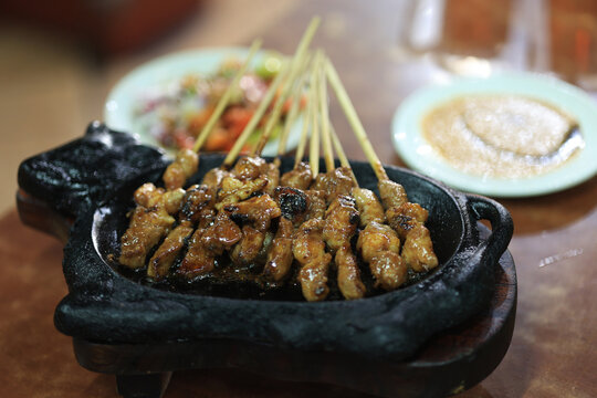 Traditional Tegal, Lamb Satay Served on Ssizzling Plate with Rice, Soup, and Spicy Soy Sauce