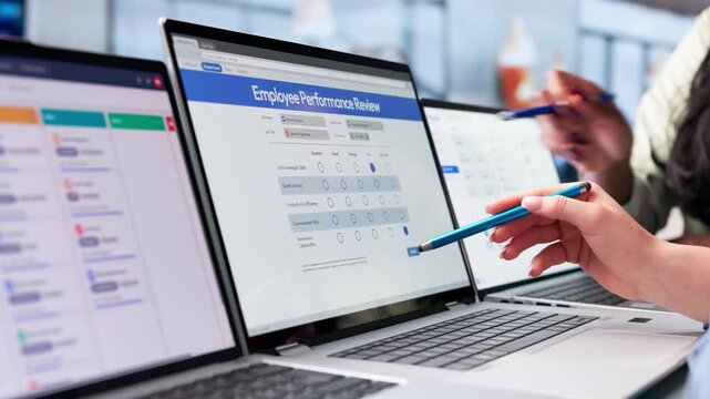 Human Resources Manager Gives Performance Feedback During Employee Appraisal