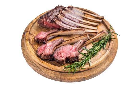 Grilled lamb chops, mutton meat cutlets steaks on wooden board isolated on white backgrounds