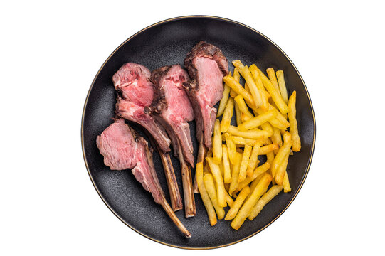 Roast lamb cutlets, mutton meat steaks on plate with french fries  isolated on white backgrounds