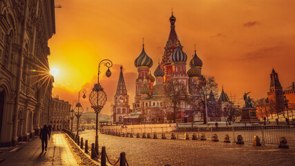 Colorful onion domes glowing in golden city sunset © PixelPlex