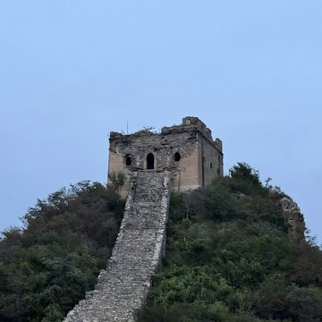 Ancient brick watchtower and steep stone stairway on the Simatai section of the Great Wall of China
