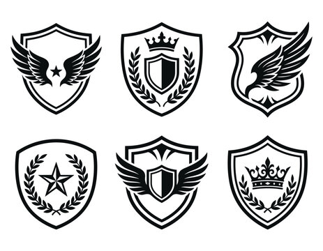 Heraldic shield crests with wings crowns and stars are displayed as a vector set on white