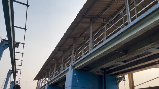Low angle view of industrial factory roof and steel structure