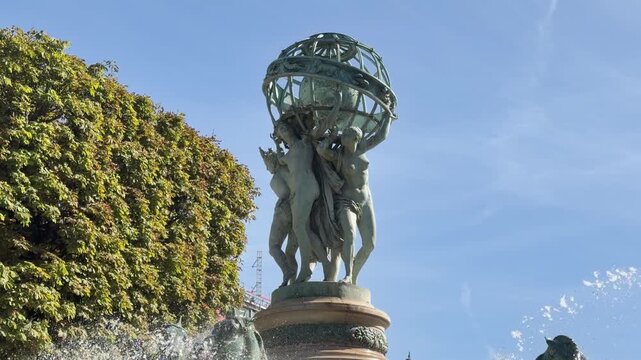 Bronze sea horses and celestial globe crown Carpeaux fountain, Paris