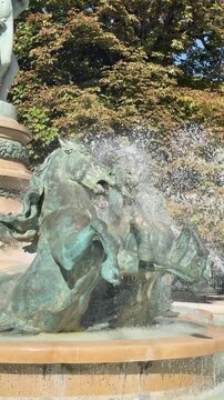 Bronze sea horses and celestial globe crown Carpeaux fountain, Paris