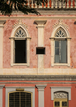 Ornate Gothic-arched windows on a weathered colonial facade, Benguela Province, Benguela, Angola