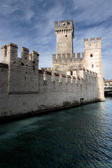 Ancient white stone castle with rectangular towers on sunny day, Sirmione, Lake Garda, Italy © Igor