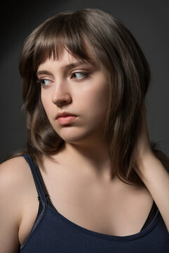 Beautiful teenage girl posing for beauty portrait on dark background