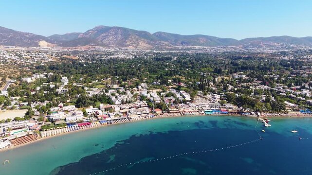 People swimming along Bitez beach in Bodrum during summer holidays