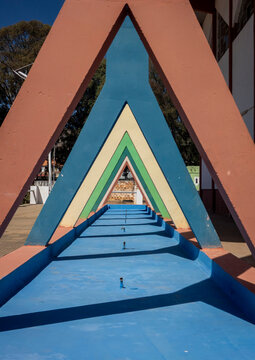 Colorful triangular arches forming a covered walkway at the old Portuguese exhibition grounds, Huila Province, Lubango, Angola