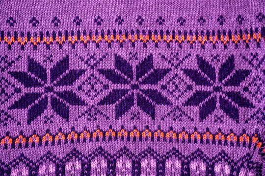 Nordic Knit Pattern Background. Texture Christmas sweater. Purple color