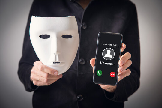 Man showing mobile phone with incoming call from unknown caller.