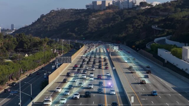 Self driving cars on american freeway showing smart city with digital overlay, futuristic transport network and augmented reality data visualization on highway traffic