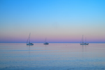 Playazo de Rodalquilar sunset, tranquil sea, anchored sailboats © Ana