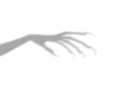 A dark scary shadow of a long clawed hand reaching out from the side presented as an isolated object on a isolated on transparent background
