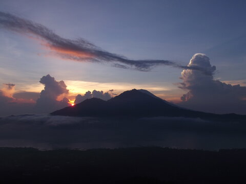 Stunning sunrise view over Mount Batur volcano and caldera from Kintamani, Bali, Indonesia