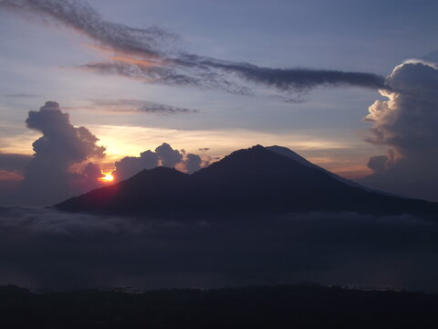 Stunning sunrise view over Mount Batur volcano and caldera from Kintamani, Bali, Indonesia