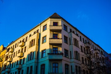 Fototapeta premium Corner apartment building facade with balconies