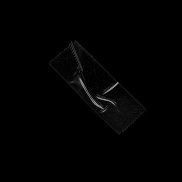 Transparent Tape Texture Brush Stroke &ndash; Clear Packing Tape with Crinkles and Folds Isolated on Black Background