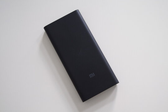 Black Xiaomi portable power bank on white background