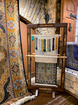Carpet weaving machine handcrafted vintage old technology .thread materials Persian Arabic carpets wool silk
