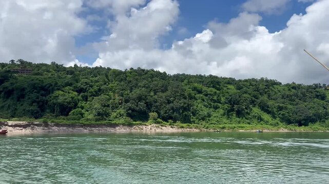 Jaflong Sylhet Stunning river landscape featuring lush green mountains and fluffy clouds in summer day
