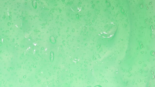 Background of transparent green gel with bubbles