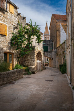 Charming narrow stone street in the old town of Stari Grad on Hvar Island, Croatia
