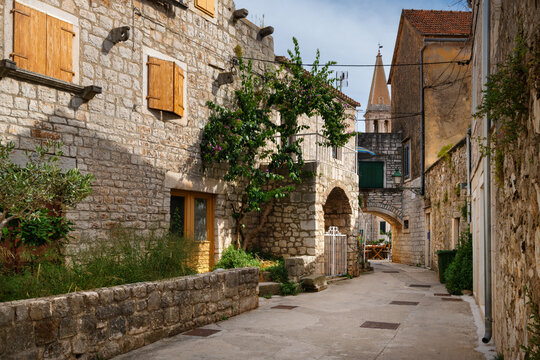 Charming narrow stone street in the old town of Stari Grad on Hvar Island, Croatia