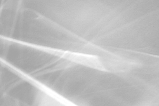 Real intersecting caustic ripple shadow cut out on a transparent png background with soft diffused edges. Anchors a serene beauty branding scene as a png overlay for.